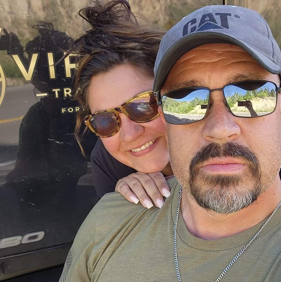 Daryl and Nicole in front of a Virago Transport truck